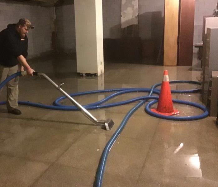 technician extracting water from floor in Cleveland