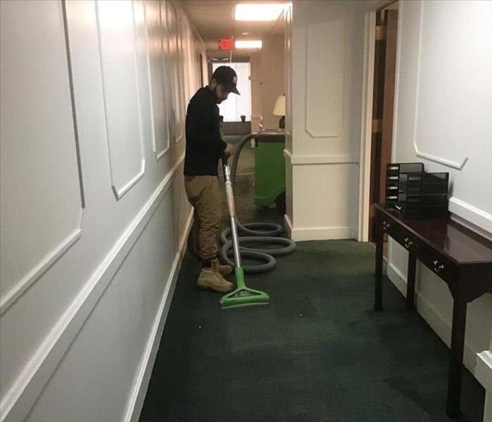 technician extracting water from hallway in Mansfield